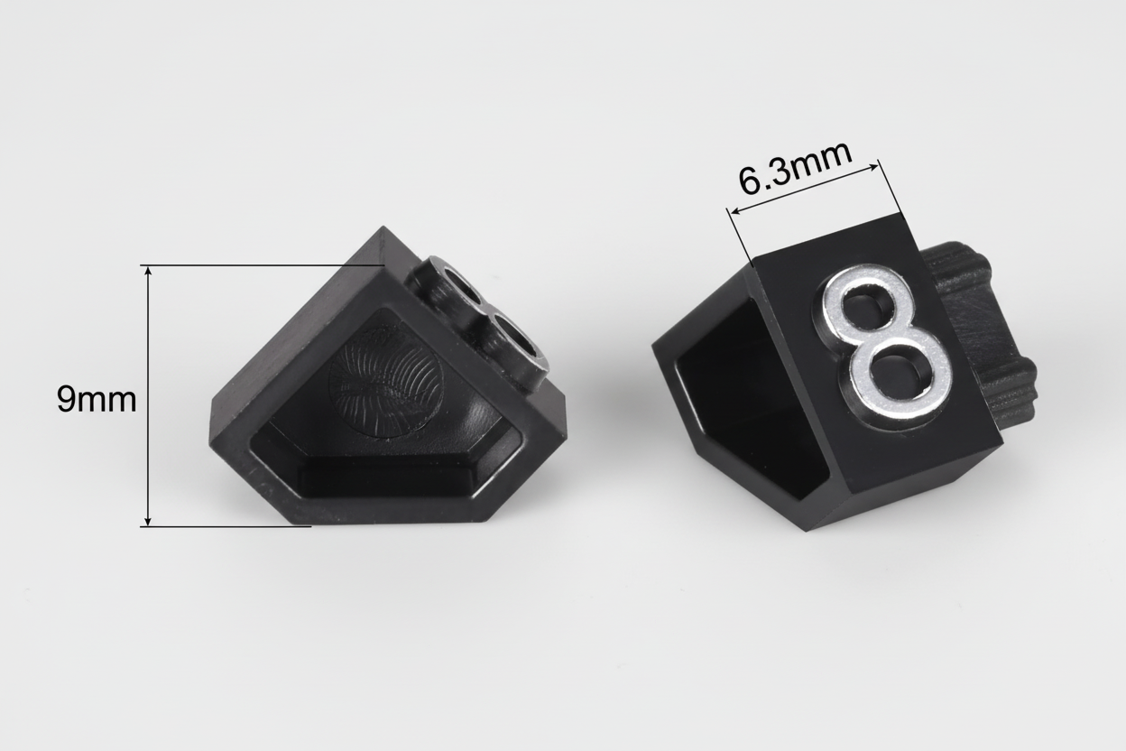 Black plastic component with measurements on a white background