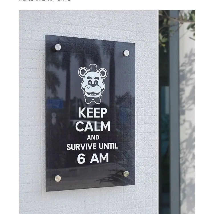 Glass door sign with bear graphic and text 'Keep Calm and Survive Until 6 AM' on a white wall.