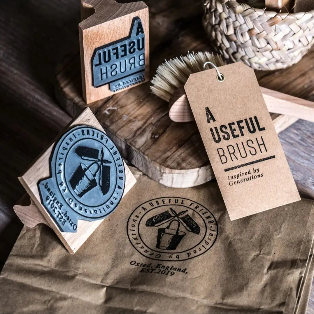 A Useful Brush packaging with branding elements on a rustic background