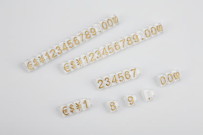Set of gold numbers on clear strips against a white background