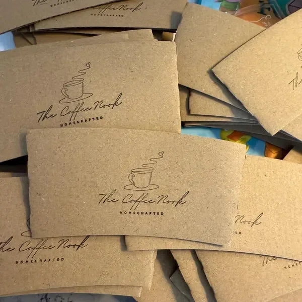 Kraft paper envelopes with 'The Coffee Nook' branding.