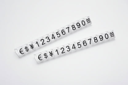 Two strips of adhesive numbers and currency symbols on a white background