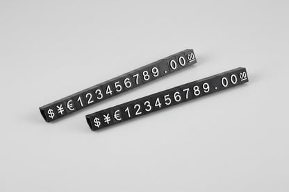 Two black number and symbol strips on a white background
