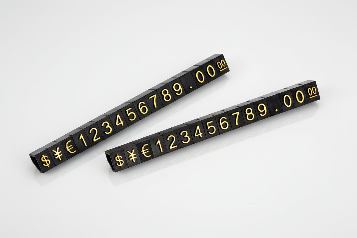 Two black number strips with gold numbers and symbols 