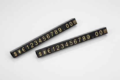 Two black number strips with gold numbers and symbols 