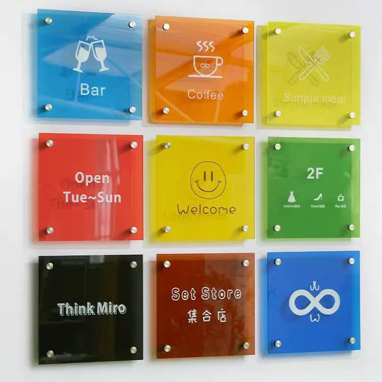 Colorful wall signs with various symbols and text on a white background